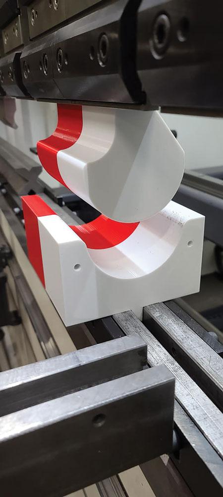 A forming tool is ready to use on a press brake. 