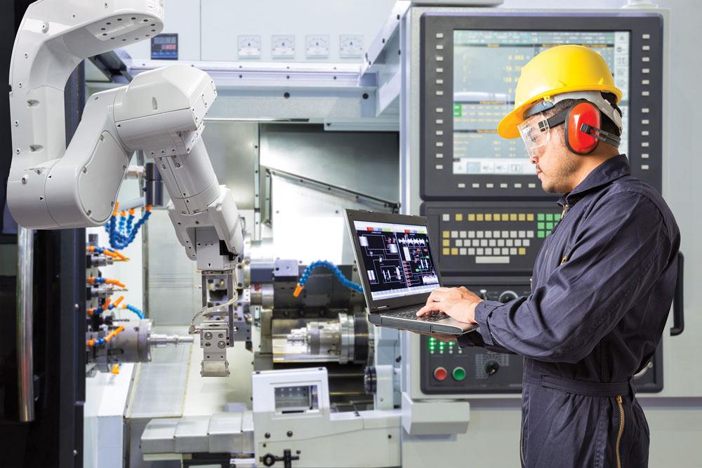 manufacturing operator working with automated machine