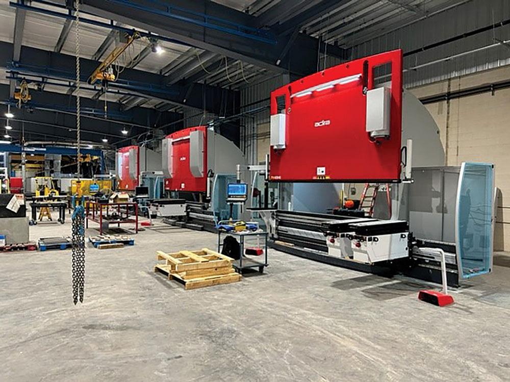 Three red 400-ton press brakes sit side by side on a shop floor.