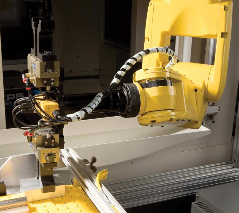 End-of-arm tooling (EOAT) for robot tending.