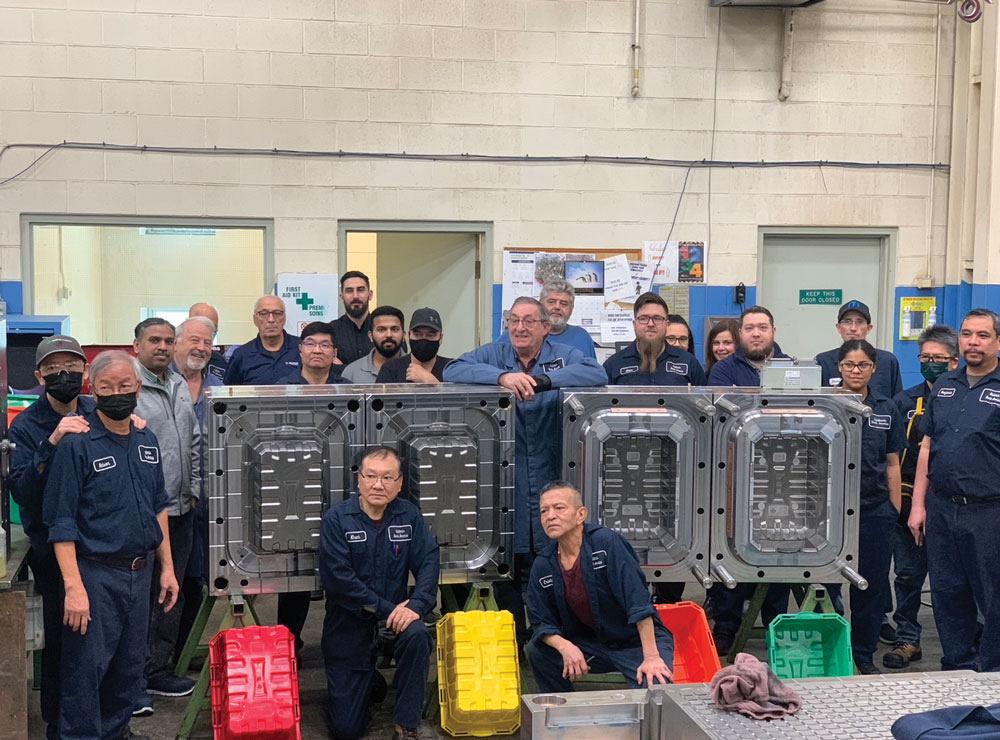 Tesan Mould team in front of molds and finished products.