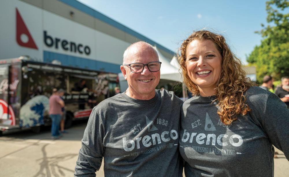 Steve and Vanessa Heim stand in front of Brenco’s manufacturing facilities.