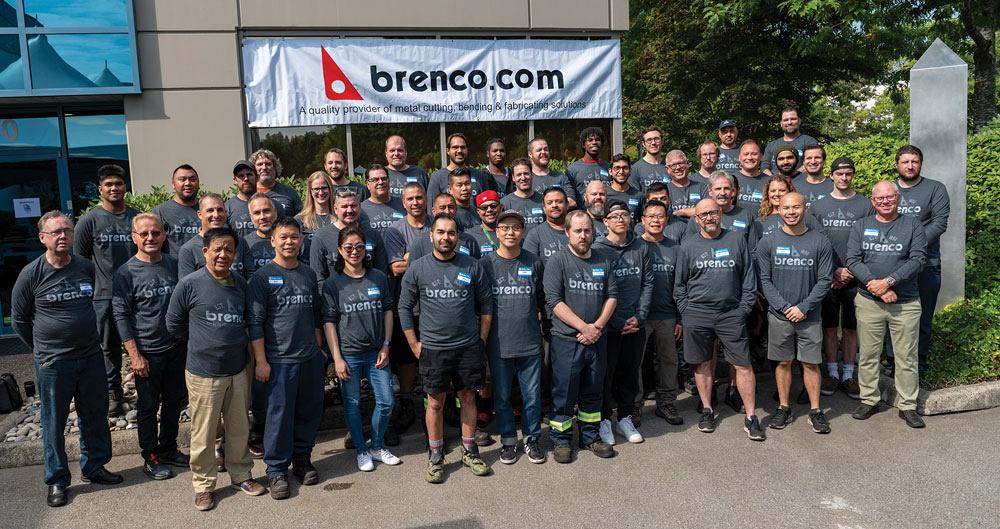 The Brenco team stands outside the company’s facility.  