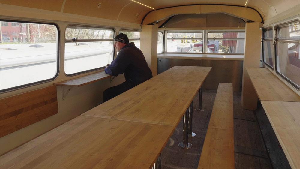 Sitting area in Apollo's refitted double-decker bus