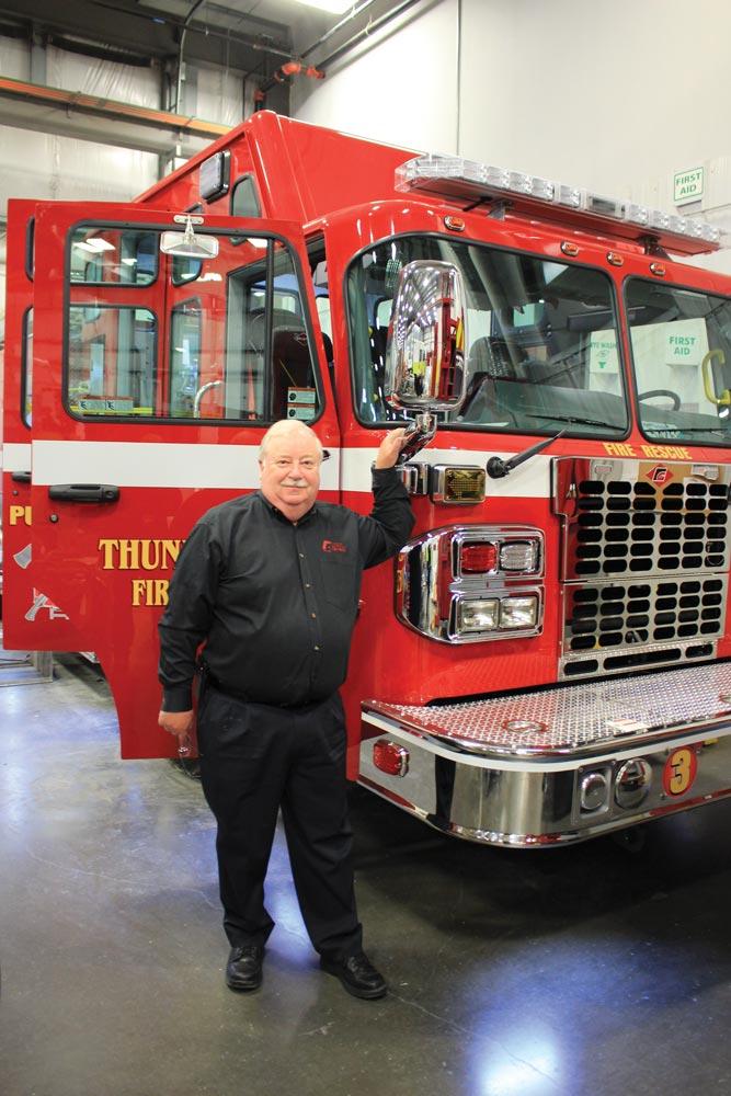 Photo of FGFT president Rick Suché with fire truck.