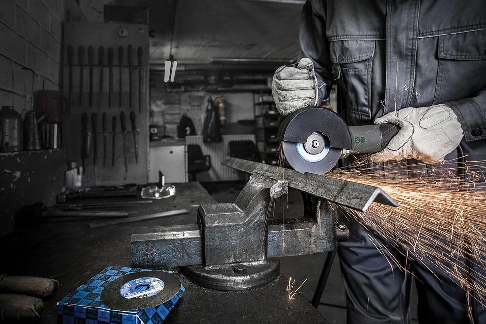 A person deflects away grinding sparks.