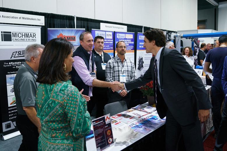 Justin Trudeau shakes hands with representatives at CAMM.