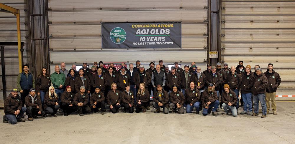 The AGI Olds team stands in a group for a photo at the plant.  