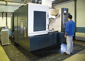 man standing at a machine tool