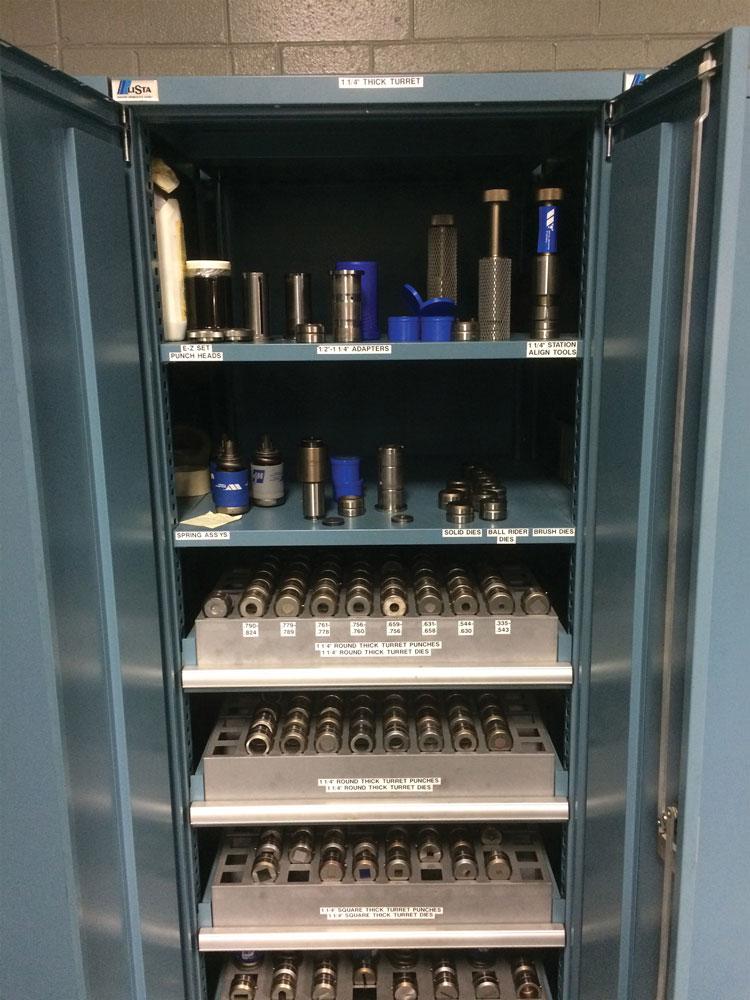 Photo of puncing tools stored in a cabinet from Wilson.