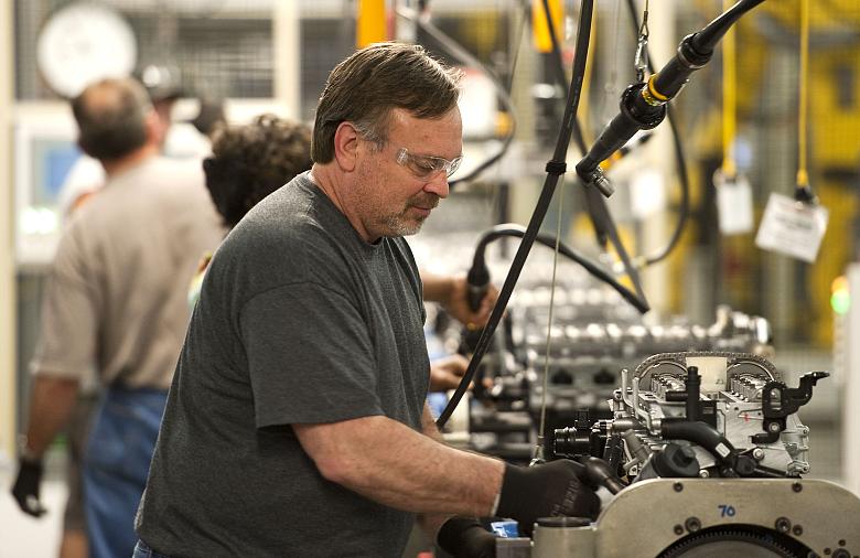 Work takes place on the assembly line at Flint Engine Operations in Michigan. (Photo: Steve Fecht/General Motors)