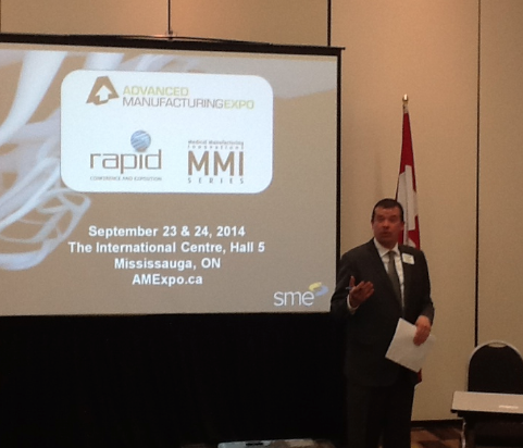 SME Group Manager Nick Samain makes an announcement about hte RAPID event coming in late 2014. (Photo: Jim Anderton/Canadian Metalworking)