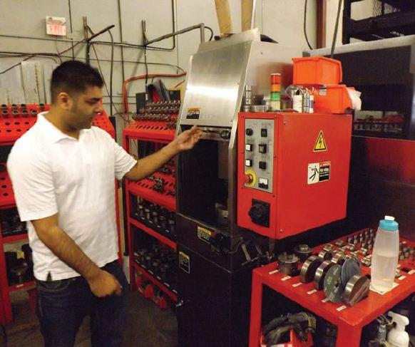 Feroz Abdulla beside the punch and die grinding station. The in-house capability keeps sharp tools at hand,
minimizing burrs and rework.
