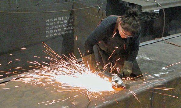 Martine Henry grinds down a weld on an unfinished Amphibex. Executive Vice President Dany Grant claims that women are some of
the company’s best employees.