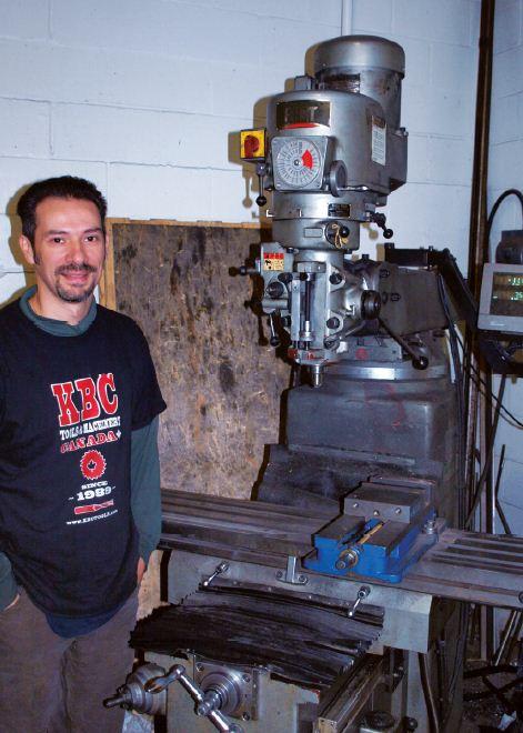 Tony Desousa with the first manual mill the company acquired.