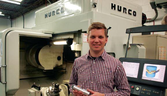 Brian Vaandering of Rian Solutions with one of the Hurco machine tools on the plant floor.