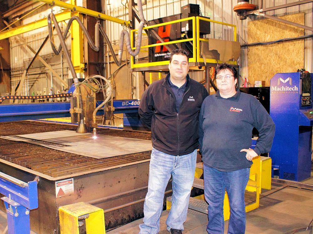 Machitech product specialist, Patrick Salois, and Metal Corbert’s general manager Lucie Godin stand in front of
the company’s Machitech plasma cutter.
PHOTO: NESTOR GULA