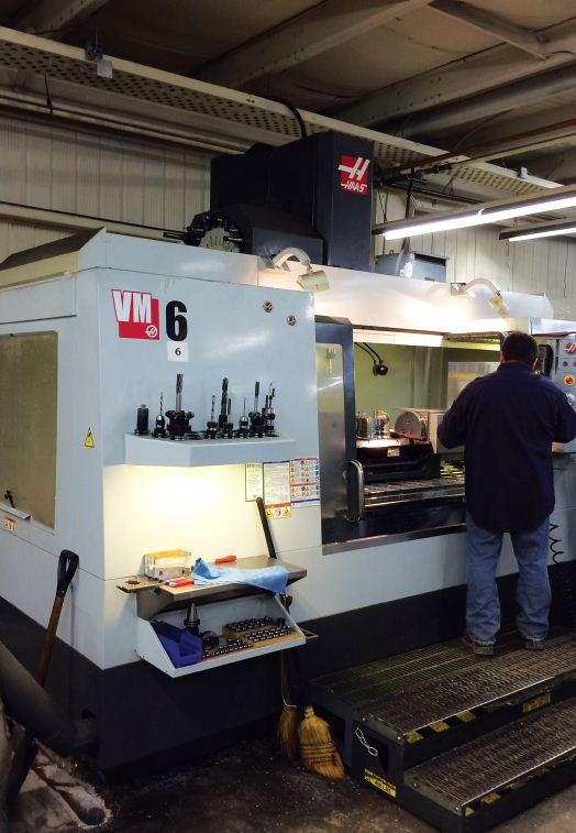 The machine shop features a number of CNC machines, including this Haas VM-6, as well as many manual machines.