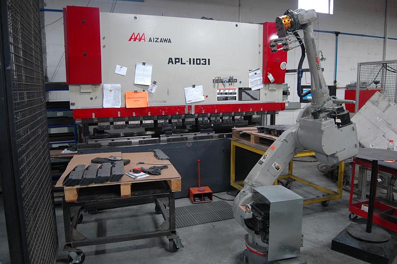 Once flats from the semiautomatic laser cutting tables are positioned, the unmanned press brake cell can complete the bends.
