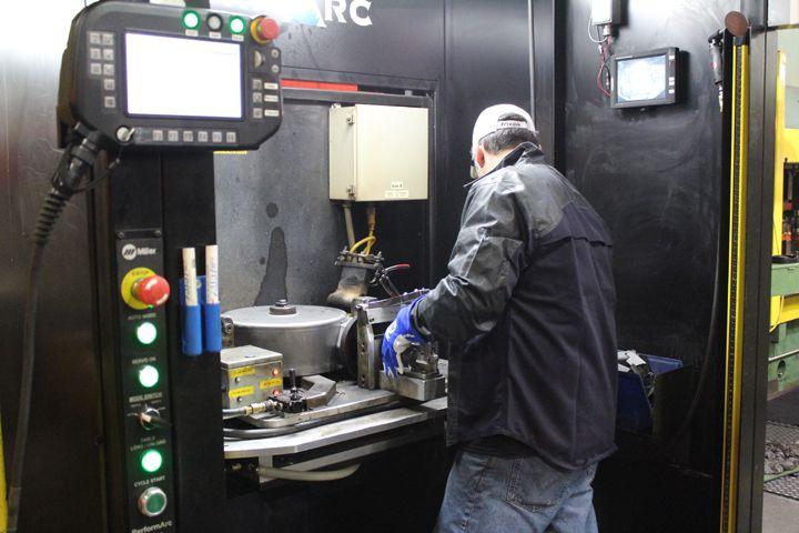 Parts are loaded into an automated welding cell. (Photo courtesy of Miller Electric Mfg Co)