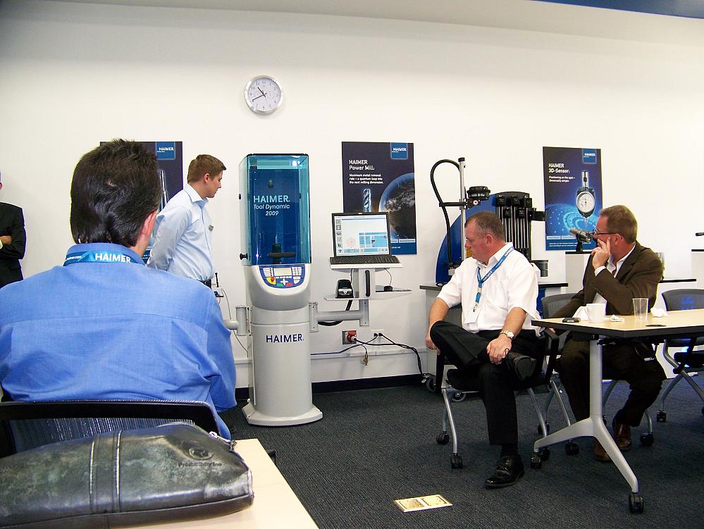 Guests at the grand opening of the expanded Haimer North America facility view a tool balancing demonstration in the training room.