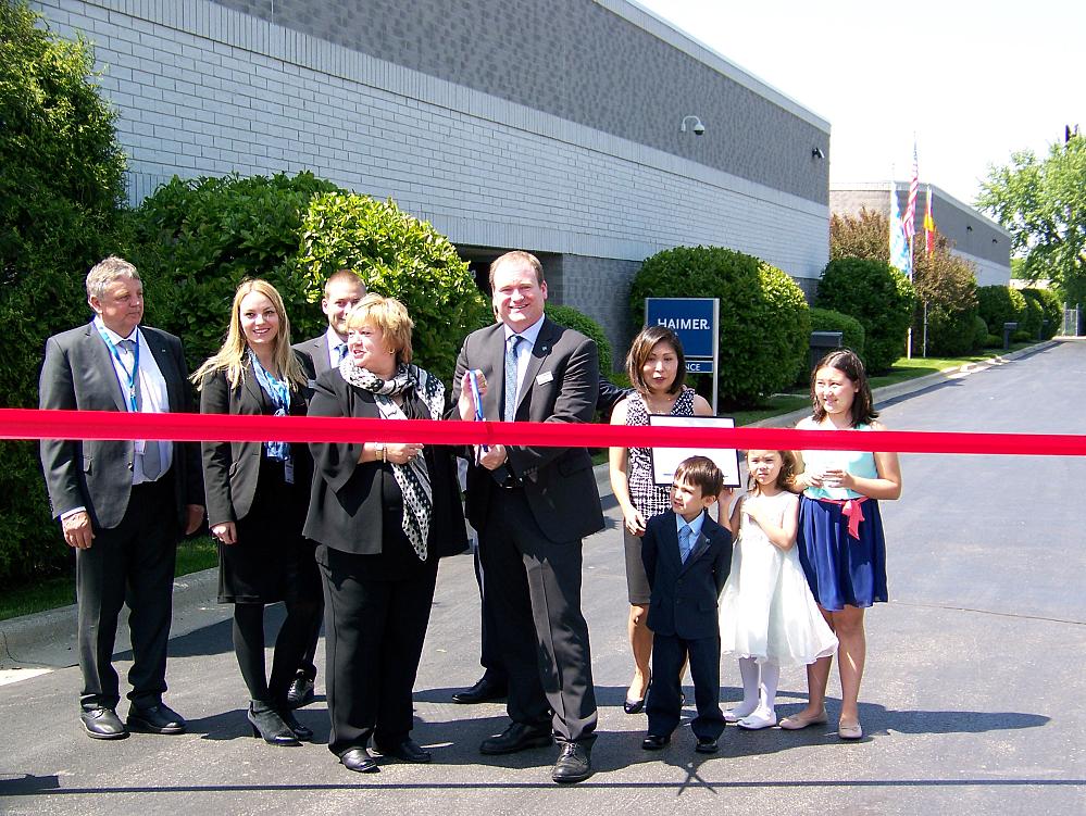 Participating in the ribbon-cutting for the expanded Haimer USA facility were (left to right) Franz Haimer, CEO of Haimer GmbH; Kathrin Haimer, head of human resources, Haimer GmbH; Franz Josef Haimer, manager special projects, Haimer GmbH; Claudia Haimer, CMO of Haimer GmbH; Brendt Holden, president of Haimer USA, and his wife Miho and children. Andreas Haimer, president of Haimer GmbH, also participated.