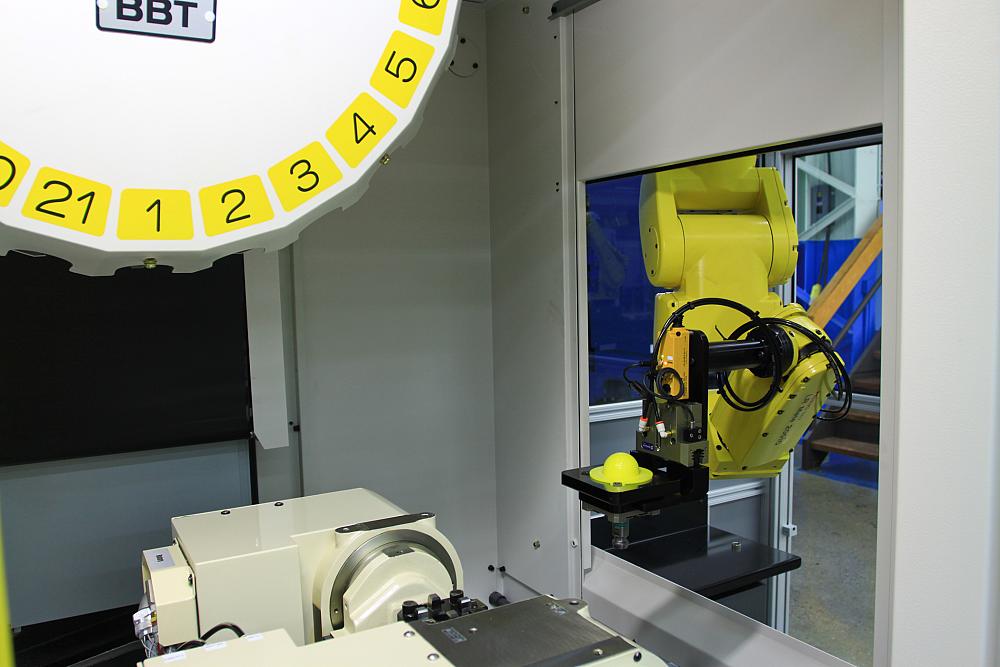 Automation can be simple, like this small robot loading a single machine, or large,
complex systems involving multiple pieces of equipment.