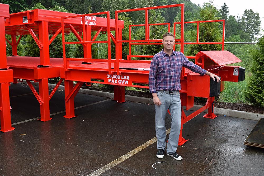 Dura-Ramp GM Brandon Edwards stands in front of a loading system ready for shipping. 