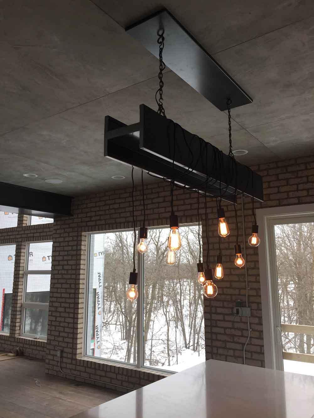 A steel faux I-beam fixture fabricated by Bang On.