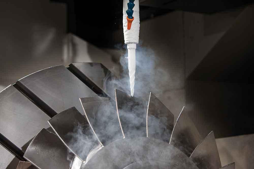 Liquid nitrogen is routed to directly below the cutting edge to remove heat from the cutting process for hard-to-cut materials. Photo courtesy of Okuma.